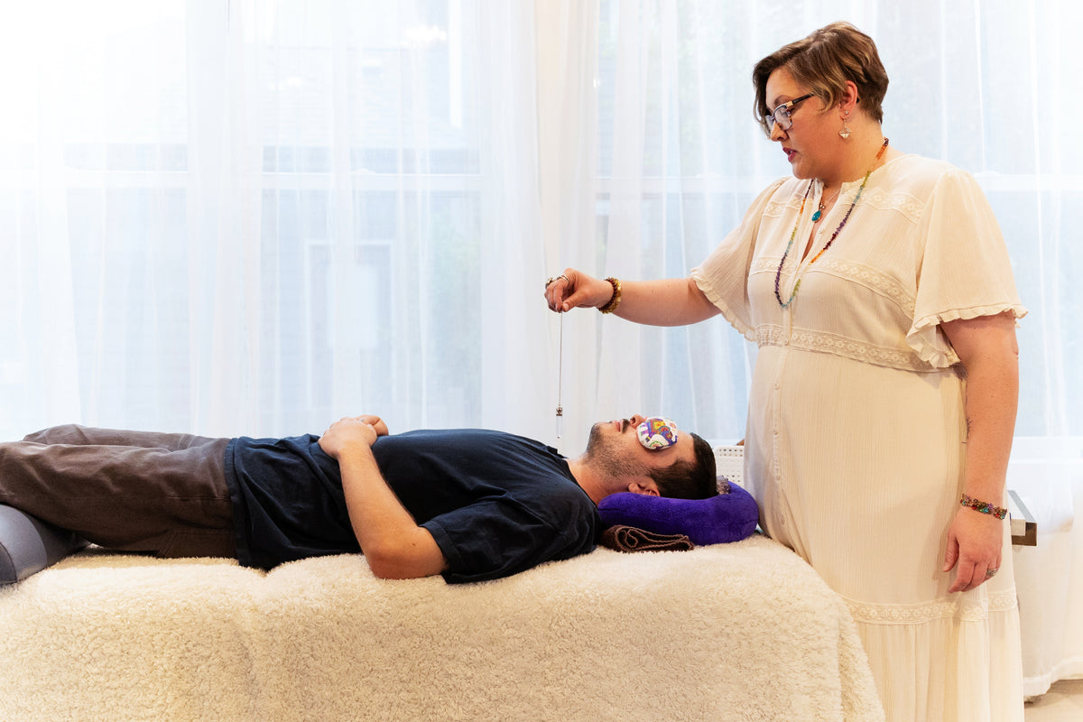 Cassie providing a Light Activation session for a reclining client